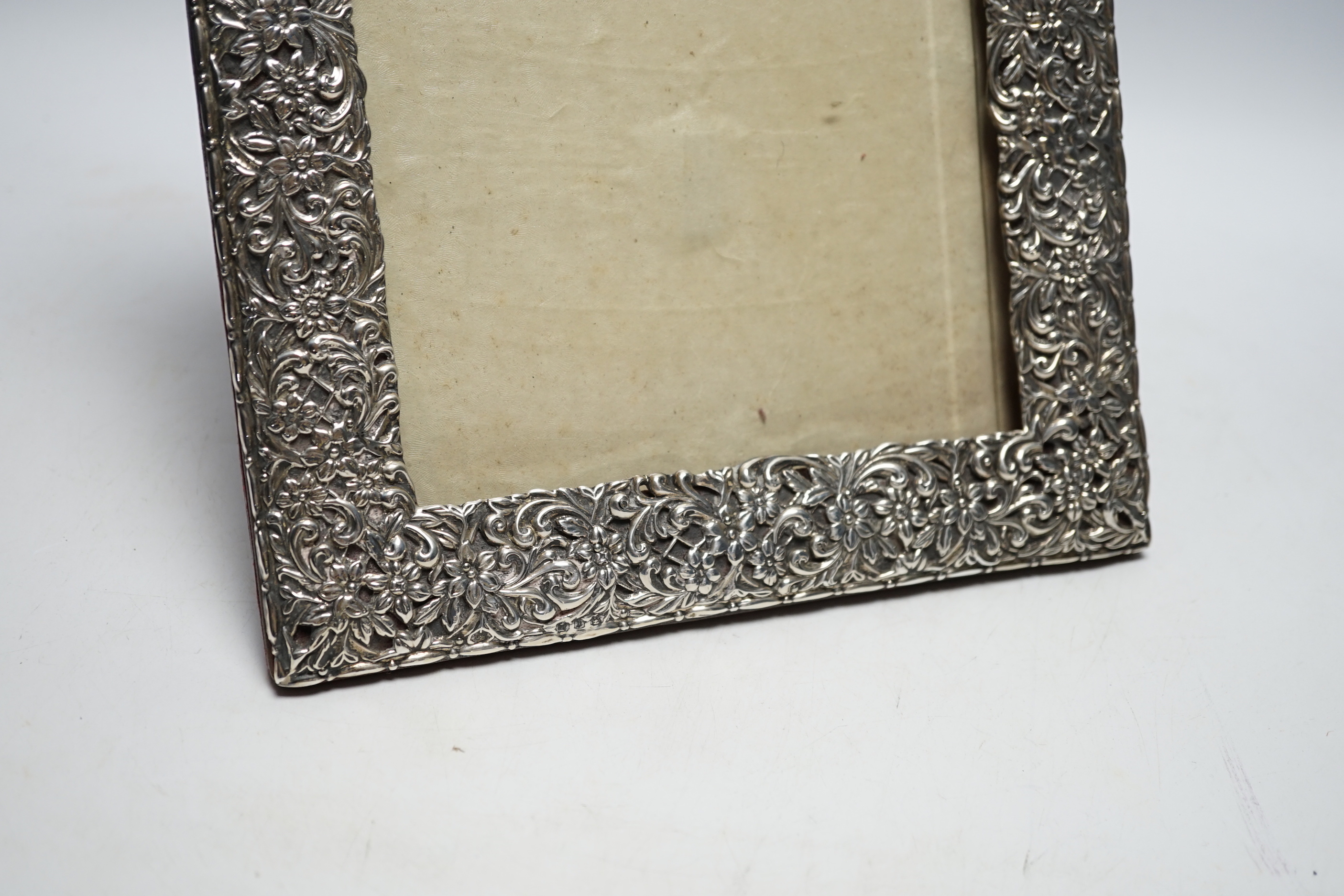 A late Victorian repousse silver mounted photograph frame, Birmingham, 1894, 29cm (a.f.)